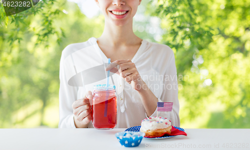 Image of happy woman celebrating american independence day