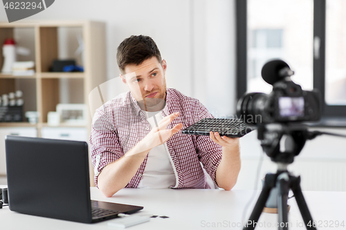 Image of male video blogger with keyboard videoblogging