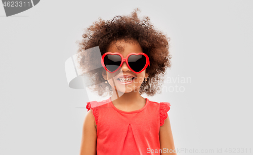 Image of african ameican girl in heart shaped sunglasses