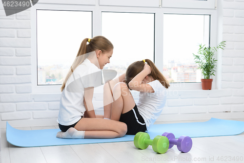 Image of The girl performed an exercise for the press, doing at home in the mode