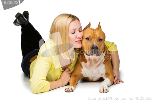 Image of Girl with amstaff dog