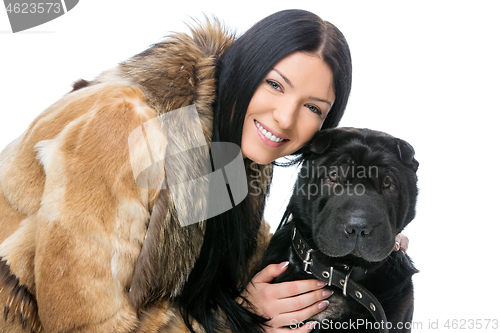 Image of Girl with black shar pei dog