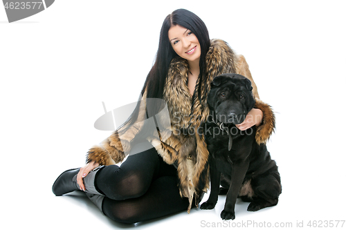Image of Girl with black shar pei dog