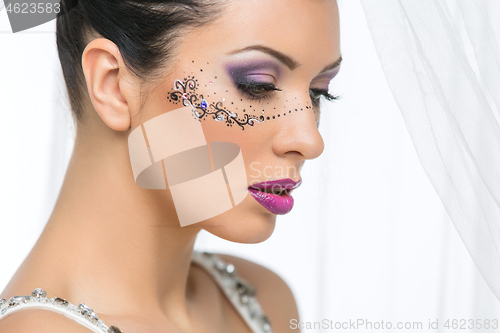 Image of Bride with mask drawn on face