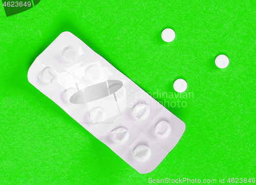 Image of Pill strip on green background