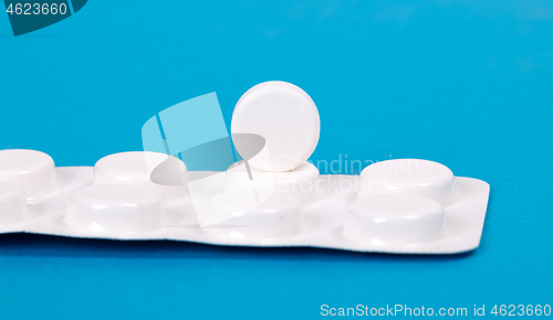 Image of Pill isolated on blue background