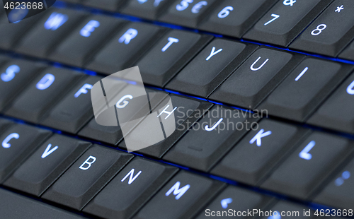 Image of Close up led backlit computer laptop keyboard