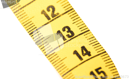 Image of Close-up of a yellow measuring tape isolated on white - 13
