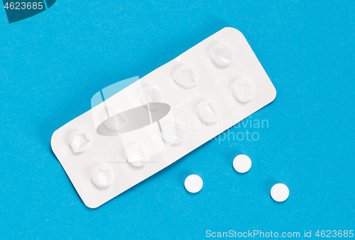 Image of Pill strip on blue on background