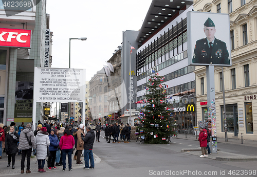 Image of Berlin, Germany - December 20, 2019: People visit famous Checkpo