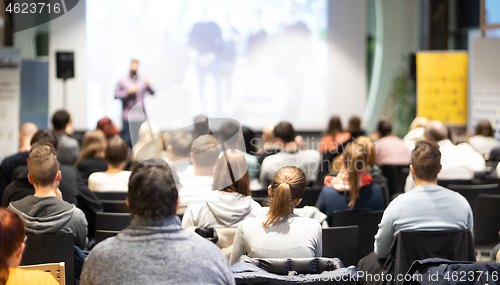 Image of Business speaker giving a talk at business conference event.