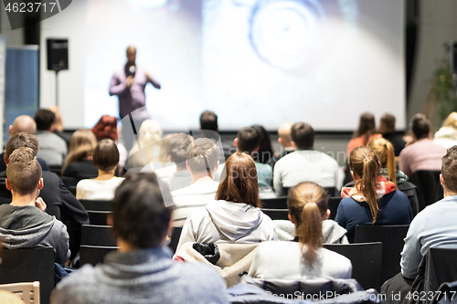 Image of Business speaker giving a talk at business conference event.