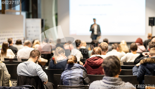 Image of Business speaker giving a talk at business conference event.