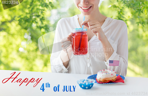 Image of happy woman celebrating american independence day