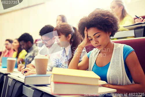 Image of group of students with coffee writing on lecture