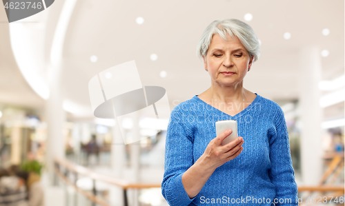 Image of senior woman using smartphone