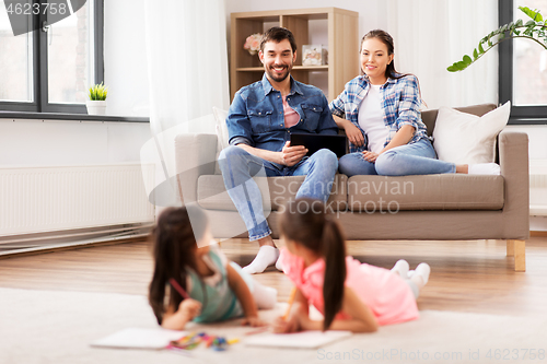 Image of happy family spending free time at home