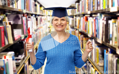 Image of happy senior graduate student woman with diploma