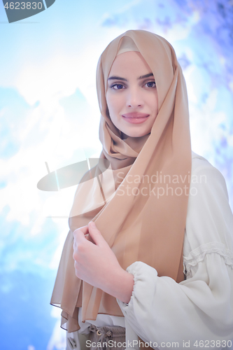 Image of portrait of beautiful muslim woman in fashionable dress