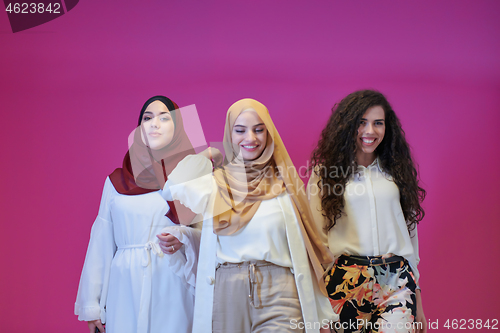 Image of muslim women in fashionable dress isolated on pink