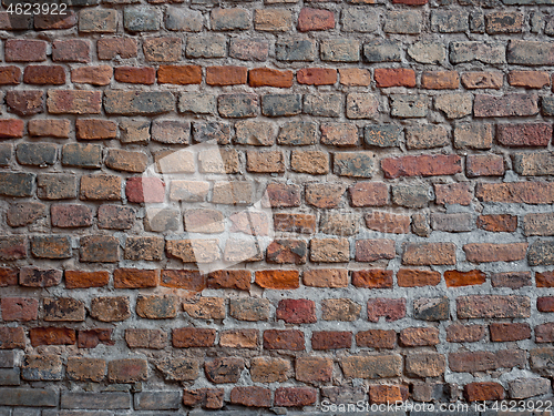 Image of Detail of a medieval castle brickwall, dark red hues