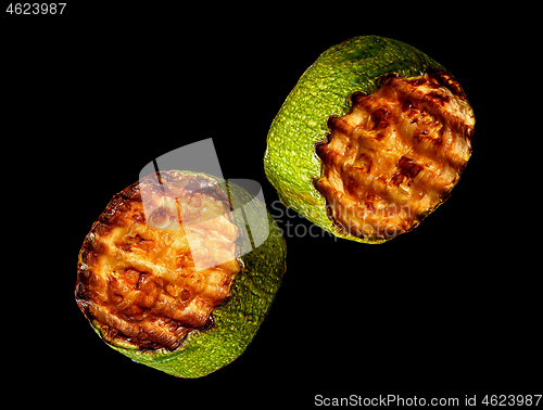 Image of Two slices of zucchini grill rotated