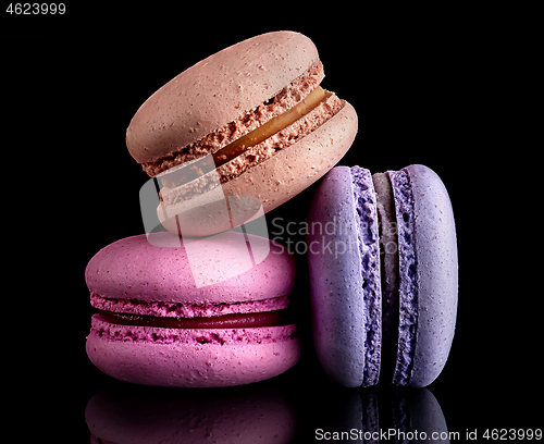 Image of Heap of colorful macaroons on black