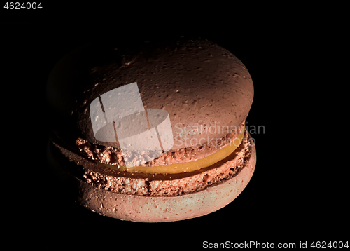 Image of One a darkened beige macaroon