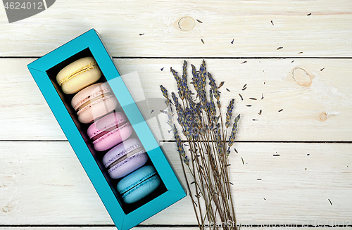 Image of Macaroons in gift box next to lavender