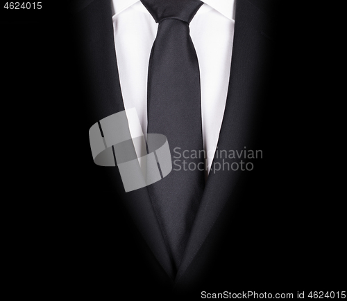 Image of Man in a black suit, close-up