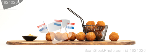 Image of Dutch traditional snack bitterbal on a serving board