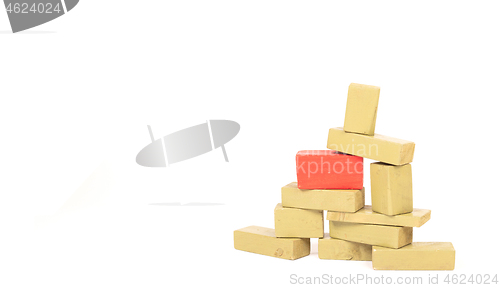 Image of Vintage green building blocks isolated on white, one standing ou