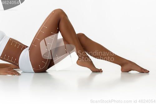 Image of Beautiful female legs and hips on white background. Beauty, cosmetics, spa, bodycare and lifting, correction surgery, fitness concept