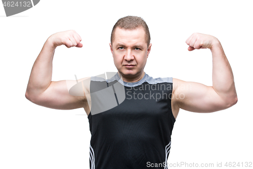 Image of Man showing biceps muscles