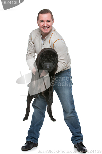 Image of Man with shar pei dog