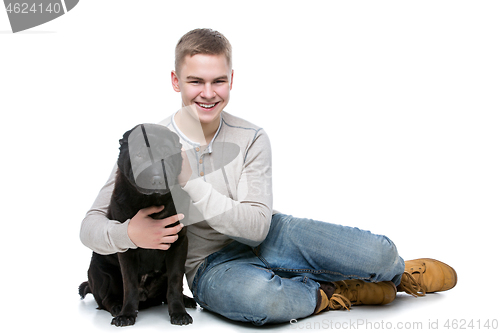 Image of Boy with shar pei dog