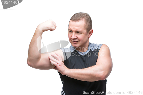 Image of Man showing biceps muscles