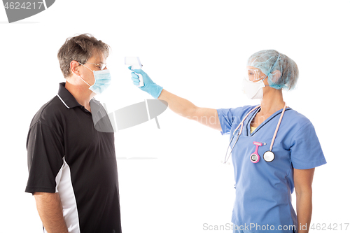 Image of COVID-19  Doctor, nurse takes a patient temperature with infrare