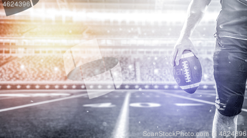 Image of closeup American Football Player isolated on big modern stadium