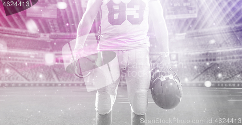 Image of closeup American Football Player isolated on big modern stadium