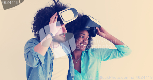 Image of multiethnic couple getting experience using VR headset glasses