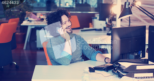 Image of businessman working using a computer in startup office