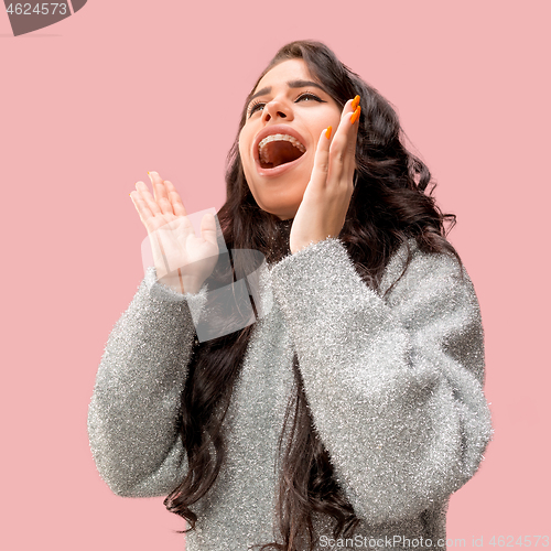 Image of Isolated on pink young casual woman shouting at studio