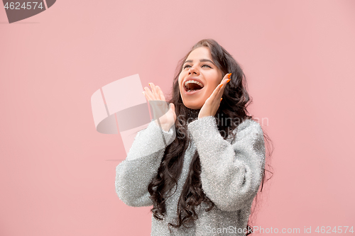 Image of Isolated on pink young casual woman shouting at studio