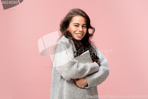 Image of Businesswoman hugging laptop. Love to computer concept.