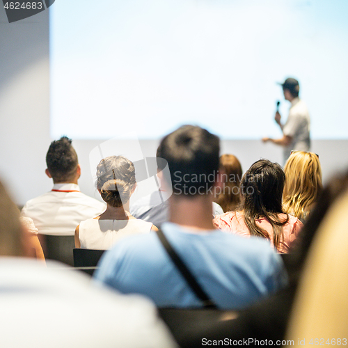 Image of Male business speaker giving a talk at business conference event.