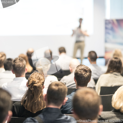 Image of Male business speaker giving a talk at business conference event.