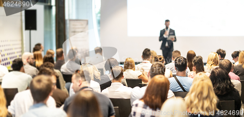 Image of Male business speaker giving a talk at business conference event.