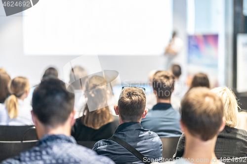 Image of Male business speaker giving a talk at business conference event.