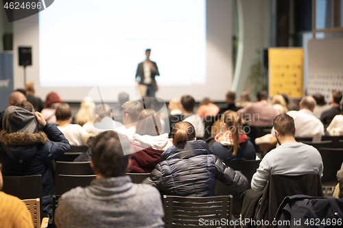 Image of Business speaker giving a talk at business conference event.